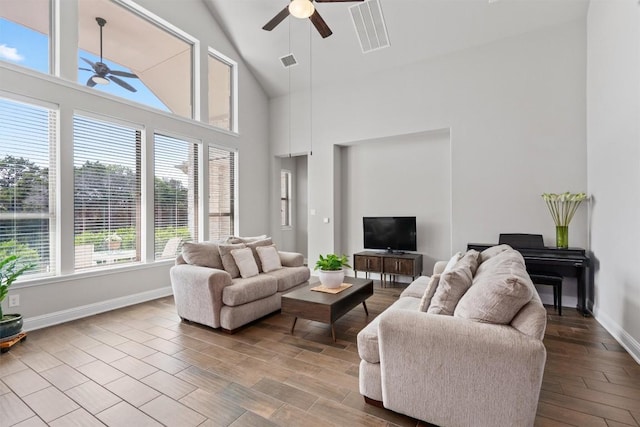 3912 Logan Ridge Dr, Cedar Park, TX 78613 - living room featuring ceiling fan, visible vents, wood finished floors, baseboards, and high vaulted ceiling