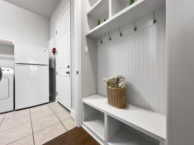 3912 Logan Ridge Dr, Cedar Park, TX 78613 - mudroom featuring light tile patterned floors and washer / clothes dryer
