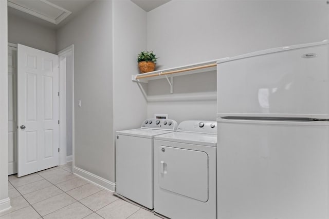 3912 Logan Ridge Dr, Cedar Park, TX 78613 - laundry room featuring light tile patterned floors, baseboards, laundry area, and washer and dryer