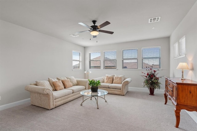 3912 Logan Ridge Dr, Cedar Park, TX 78613 - living area featuring visible vents, a ceiling fan, baseboards, and light carpet