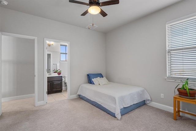 3912 Logan Ridge Dr, Cedar Park, TX 78613 - bedroom featuring a ceiling fan, baseboards, light colored carpet, and ensuite bath
