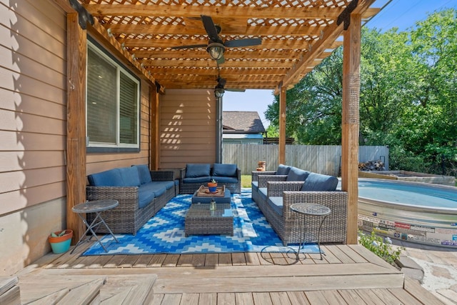 wooden deck with fence, an outdoor living space, a pergola, and ceiling fan