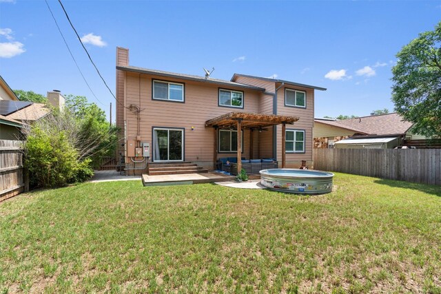 back of house with a pergola, a jacuzzi, a patio, a chimney, and entry steps