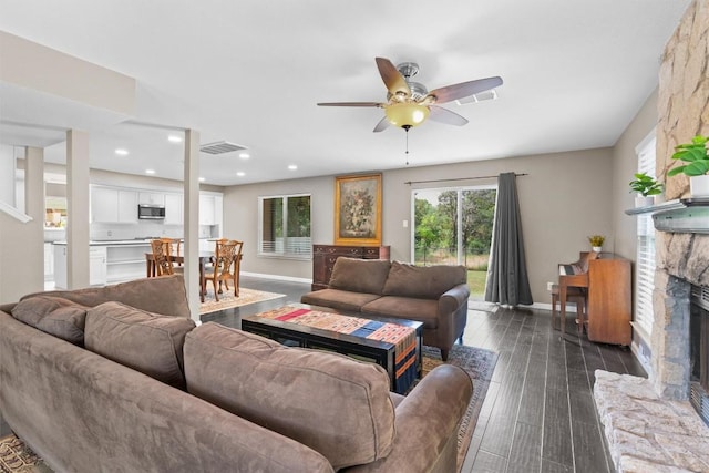 6551 Fair Valley Trl, Austin, TX 78749 - living room featuring a fireplace, a ceiling fan, baseboards, recessed lighting, and dark wood finished floors