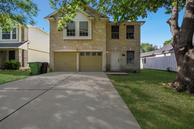 1320 Green Terrace Dr, Round Rock, TX 78664 - traditional home featuring an attached garage, stone siding, a front lawn, and driveway