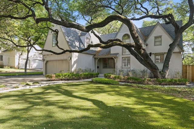 1006 Gaston Ave, Austin, TX 78703 - view of front of house with a garage, fence, a front lawn, and driveway