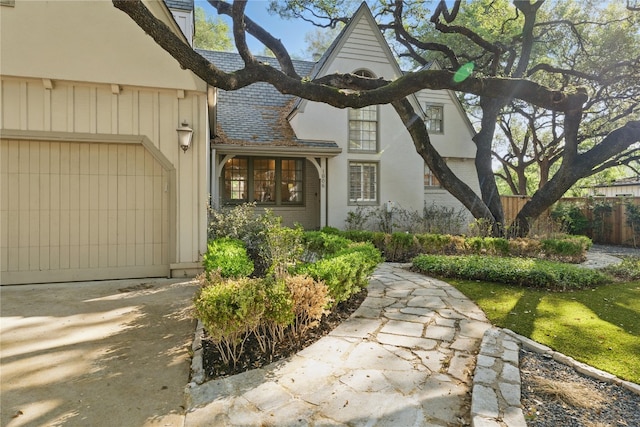1006 Gaston Ave, Austin, TX 78703 - view of front of home with brick siding, driveway, a garage, and fence