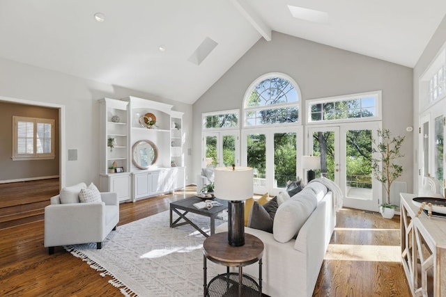 1006 Gaston Ave, Austin, TX 78703 - living room with beam ceiling, light wood-style floors, high vaulted ceiling, a healthy amount of sunlight, and french doors