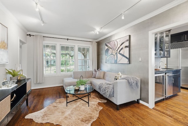 1006 Gaston Ave, Austin, TX 78703 - living area with crown molding, rail lighting, wood finished floors, and beverage cooler