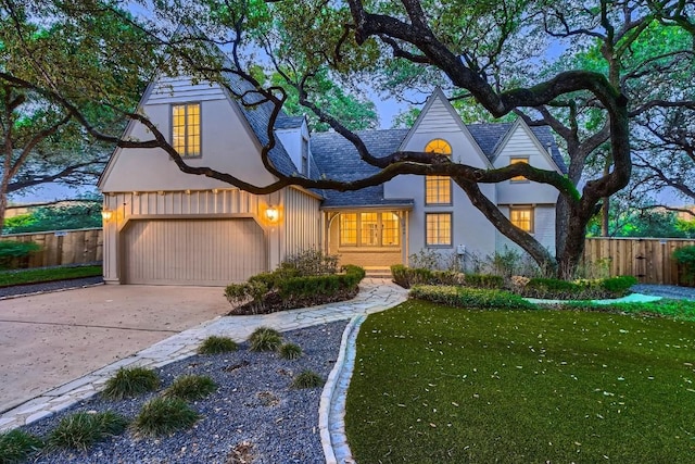 1006 Gaston Ave, Austin, TX 78703 - view of front of home with a garage, fence, a front yard, and driveway