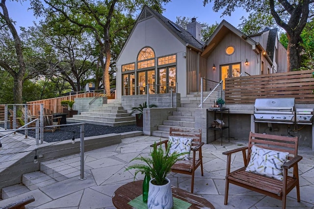 1006 Gaston Ave, Austin, TX 78703 - rear view of house featuring a patio, stairway, french doors, and a chimney