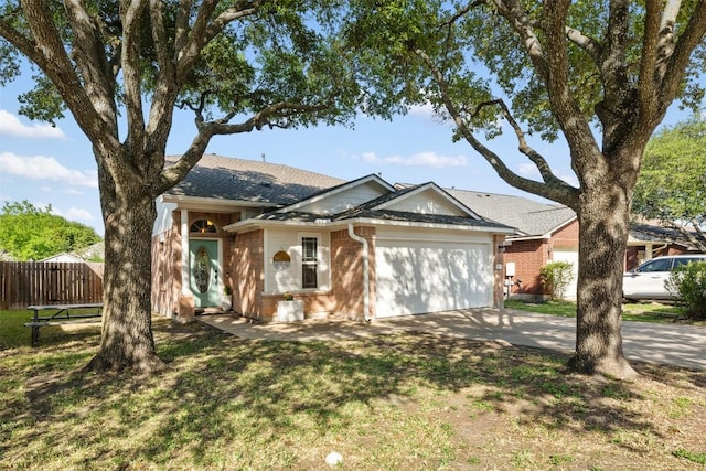 3116 Port Anne Way, Leander, TX 78641 - ranch-style home with a garage, brick siding, concrete driveway, and a shingled roof