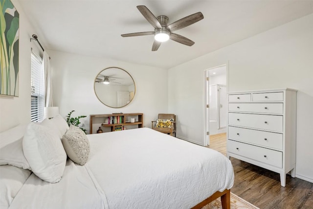 3116 Port Anne Way, Leander, TX 78641 - bedroom featuring wood finished floors, ensuite bathroom, a ceiling fan, and baseboards