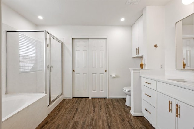 3116 Port Anne Way, Leander, TX 78641 - full bath with wood finished floors, vanity, a shower stall, a bath, and recessed lighting