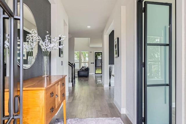 15500 La Catania Way, Austin, TX 78738 - hall featuring wood finished floors, stairway, and baseboards