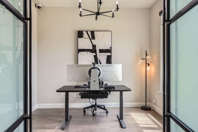 15500 La Catania Way, Austin, TX 78738 - office area featuring wood finished floors, a chandelier, and baseboards