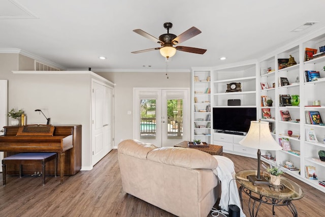2409 Mormon Mill Rd, Marble Falls, TX 78654 - living room featuring a ceiling fan, wood finished floors, ornamental molding, visible vents, and recessed lighting
