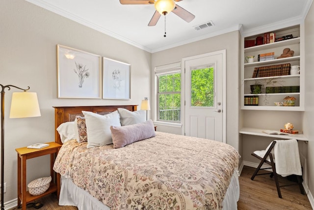 2409 Mormon Mill Rd, Marble Falls, TX 78654 - bedroom with a ceiling fan, crown molding, wood finished floors, and visible vents