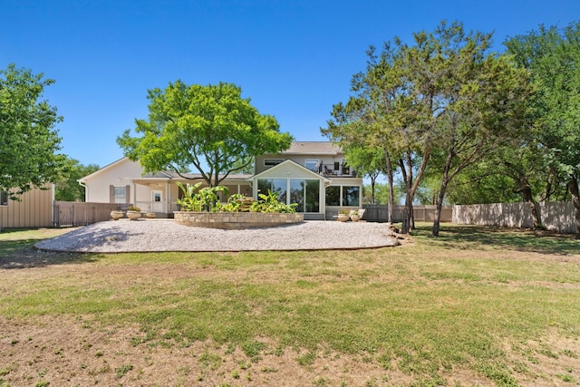 2409 Mormon Mill Rd, Marble Falls, TX 78654 - rear view of property with fence, a yard, and a patio