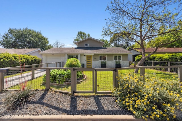 view of front of property featuring a garage, a gate, and brick siding