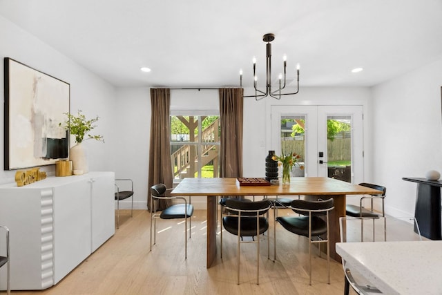 dining room with french doors, recessed lighting, light wood-style floors, a chandelier, and baseboards
