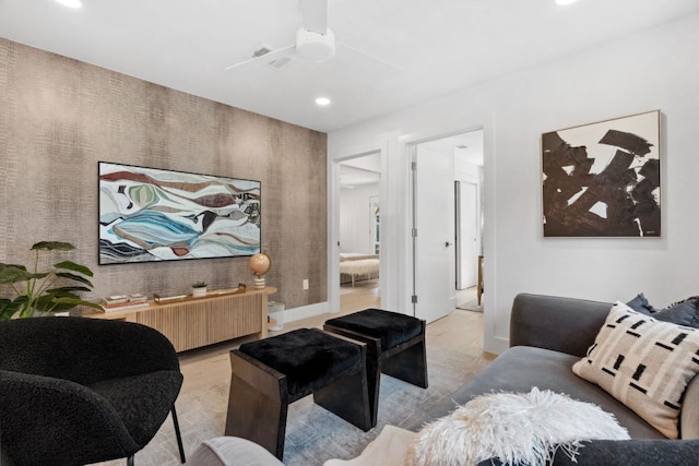 living room featuring recessed lighting, ceiling fan, and baseboards
