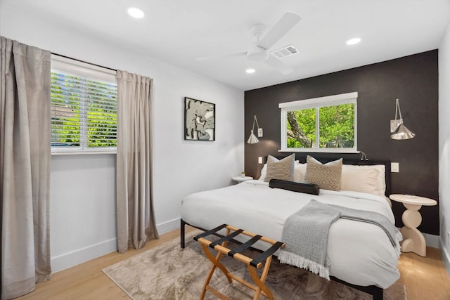 bedroom featuring recessed lighting, baseboards, wood finished floors, and a ceiling fan