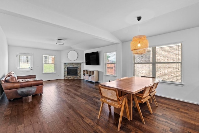 11928 Arran St, Austin, TX 78754 - dining area with a wealth of natural light, dark wood-style flooring, and a fireplace