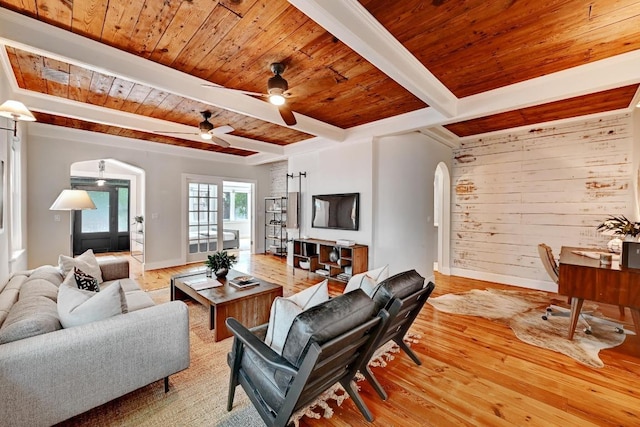 702 W Mary St, Austin, TX 78704 - living area featuring arched walkways, wood ceiling with exposed beams, wood finished floors, ceiling fan, and baseboards