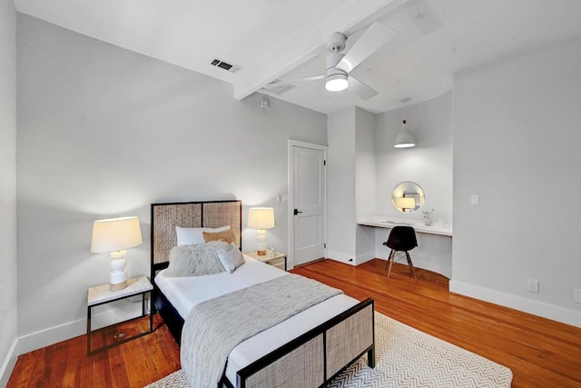 702 W Mary St, Austin, TX 78704 - bedroom featuring baseboards, wood finished floors, and ceiling fan