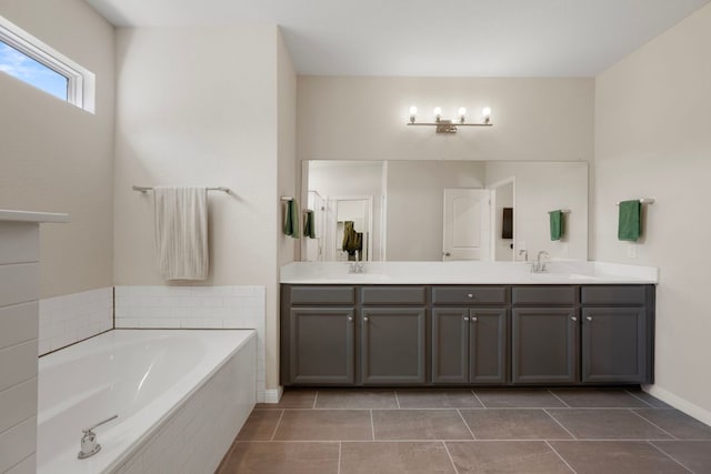 1921 Winston Way, Leander, TX 78641 - full bath featuring double vanity, a garden tub, and tile patterned flooring