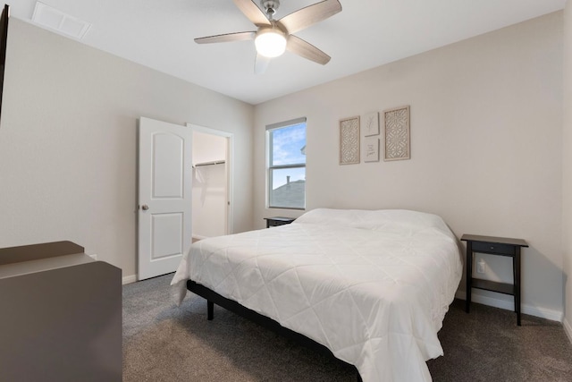 1921 Winston Way, Leander, TX 78641 - bedroom with carpet floors, a walk in closet, and a ceiling fan