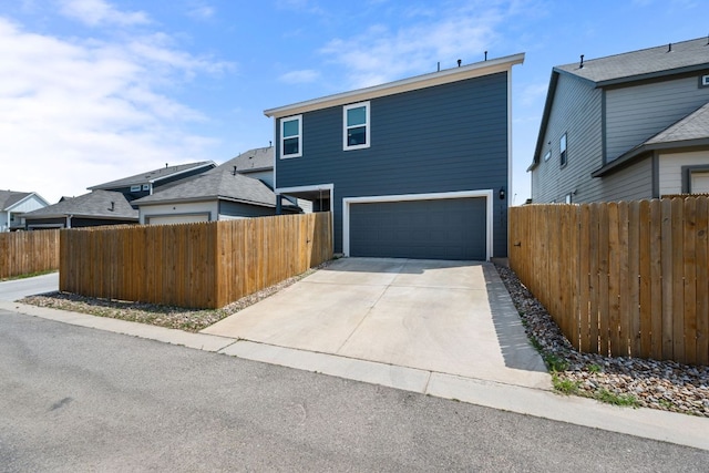 1921 Winston Way, Leander, TX 78641 - view of front of home featuring an attached garage and concrete driveway