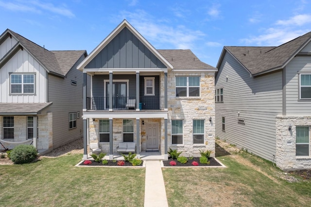 1921 Winston Way, Leander, TX 78641 - view of front facade featuring board and batten siding, a balcony, stone siding, and covered porch
