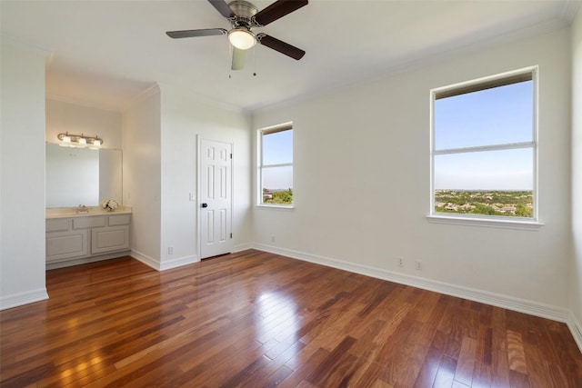 12400 Fairfax Ridge Pl, Austin, TX 78738 - unfurnished bedroom featuring ornamental molding, wood finished floors, baseboards, connected bathroom, and a ceiling fan