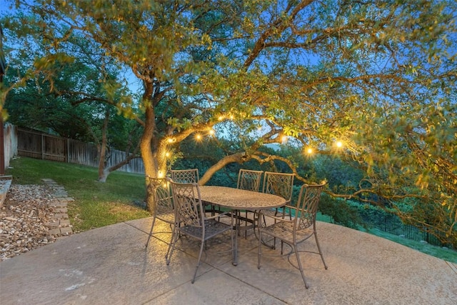view of patio with a fenced backyard and outdoor dining area