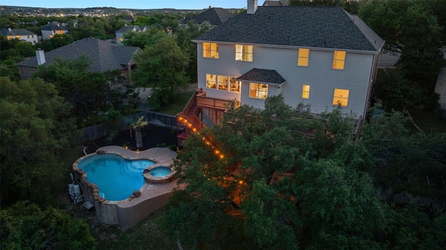 12400 Fairfax Ridge Pl, Austin, TX 78738 - back of house with a chimney, a fenced backyard, a pool with connected hot tub, and stairway