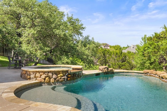 12400 Fairfax Ridge Pl, Austin, TX 78738 - view of swimming pool featuring a pool with connected hot tub and a patio area