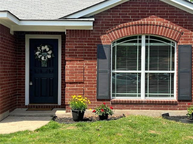 entrance to property with brick siding