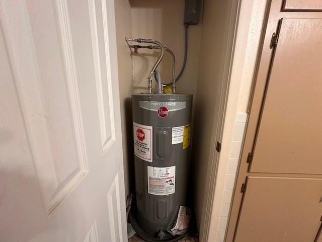 utility room with electric water heater