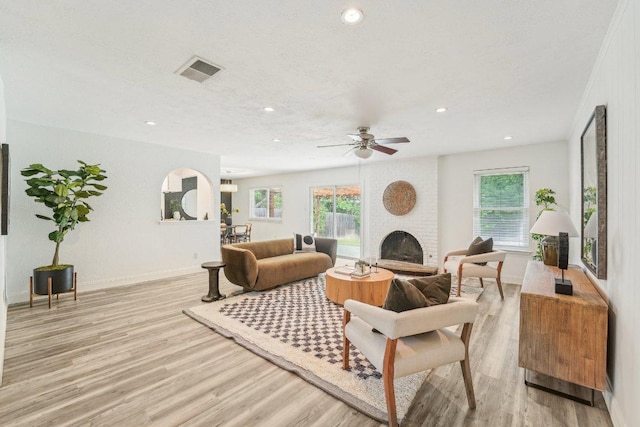 6111 Bridlington Cir, Austin, TX 78745 - living room with light wood-style floors, plenty of natural light, a fireplace, recessed lighting, and a ceiling fan
