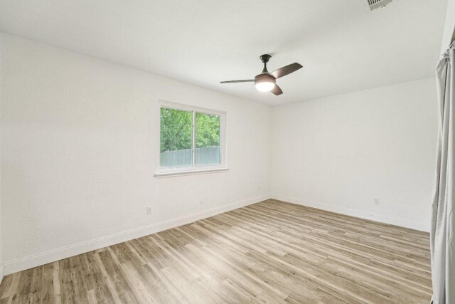 6111 Bridlington Cir, Austin, TX 78745 - spare room with light wood-type flooring and ceiling fan