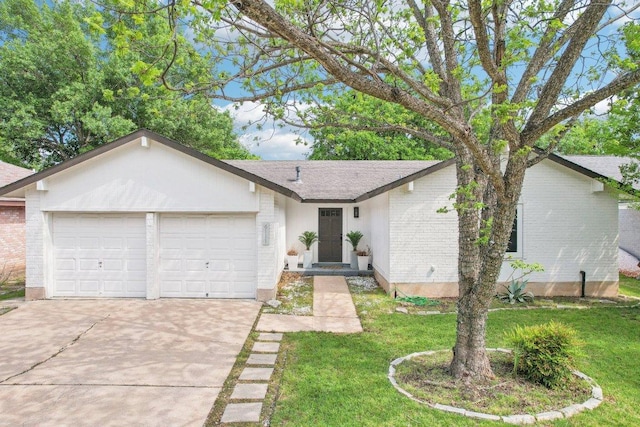 6111 Bridlington Cir, Austin, TX 78745 - view of front of house featuring brick siding, an attached garage, driveway, and a front yard