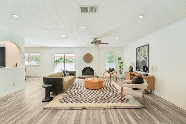 6111 Bridlington Cir, Austin, TX 78745 - living room with wood finished floors, plenty of natural light, a ceiling fan, a textured ceiling, and recessed lighting