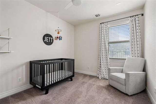 624 Anfield Cir, Austin, TX 78738 - carpeted bedroom featuring a crib, baseboards, and a ceiling fan