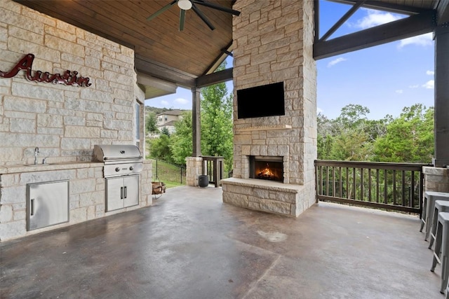 624 Anfield Cir, Austin, TX 78738 - view of patio featuring an outdoor stone fireplace, ceiling fan, and a sink