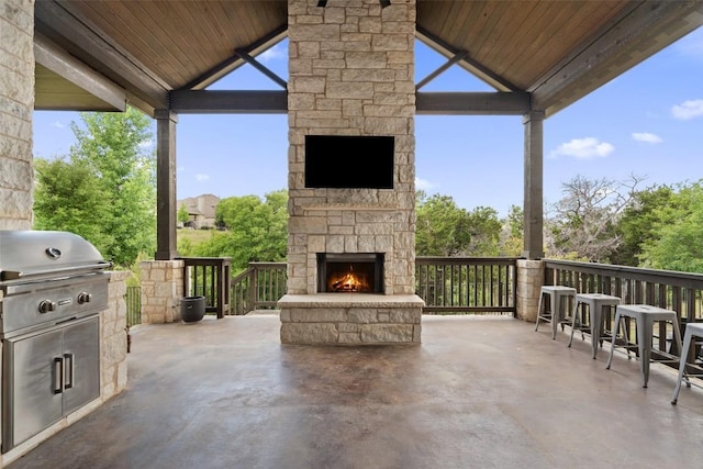 624 Anfield Cir, Austin, TX 78738 - view of patio / terrace with an outdoor stone fireplace, a gazebo, and exterior kitchen
