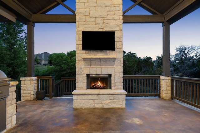 624 Anfield Cir, Austin, TX 78738 - view of patio / terrace with an outdoor stone fireplace and a gazebo