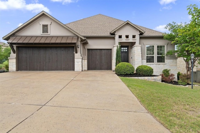 624 Anfield Cir, Austin, TX 78738 - view of front of house with stucco siding, stone siding, a garage, driveway, and a front lawn
