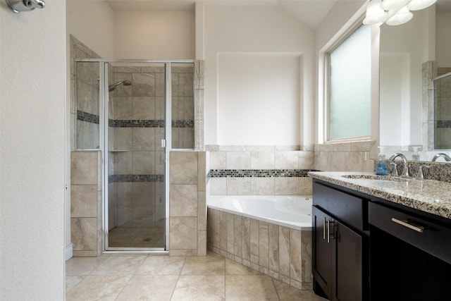 624 Anfield Cir, Austin, TX 78738 - bathroom featuring vanity, a bath, a shower stall, and tile patterned floors